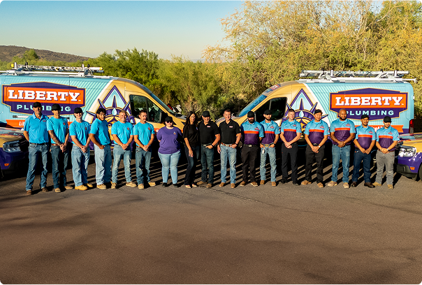The Liberty Plumbing crew and trucks